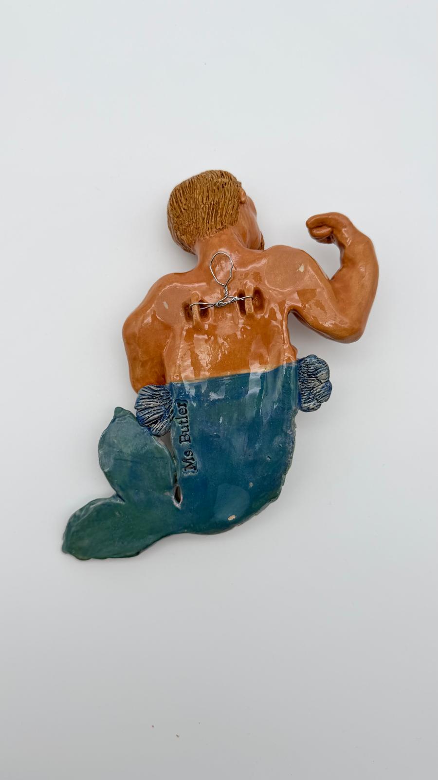 Decorative mermaid figurine with a white background